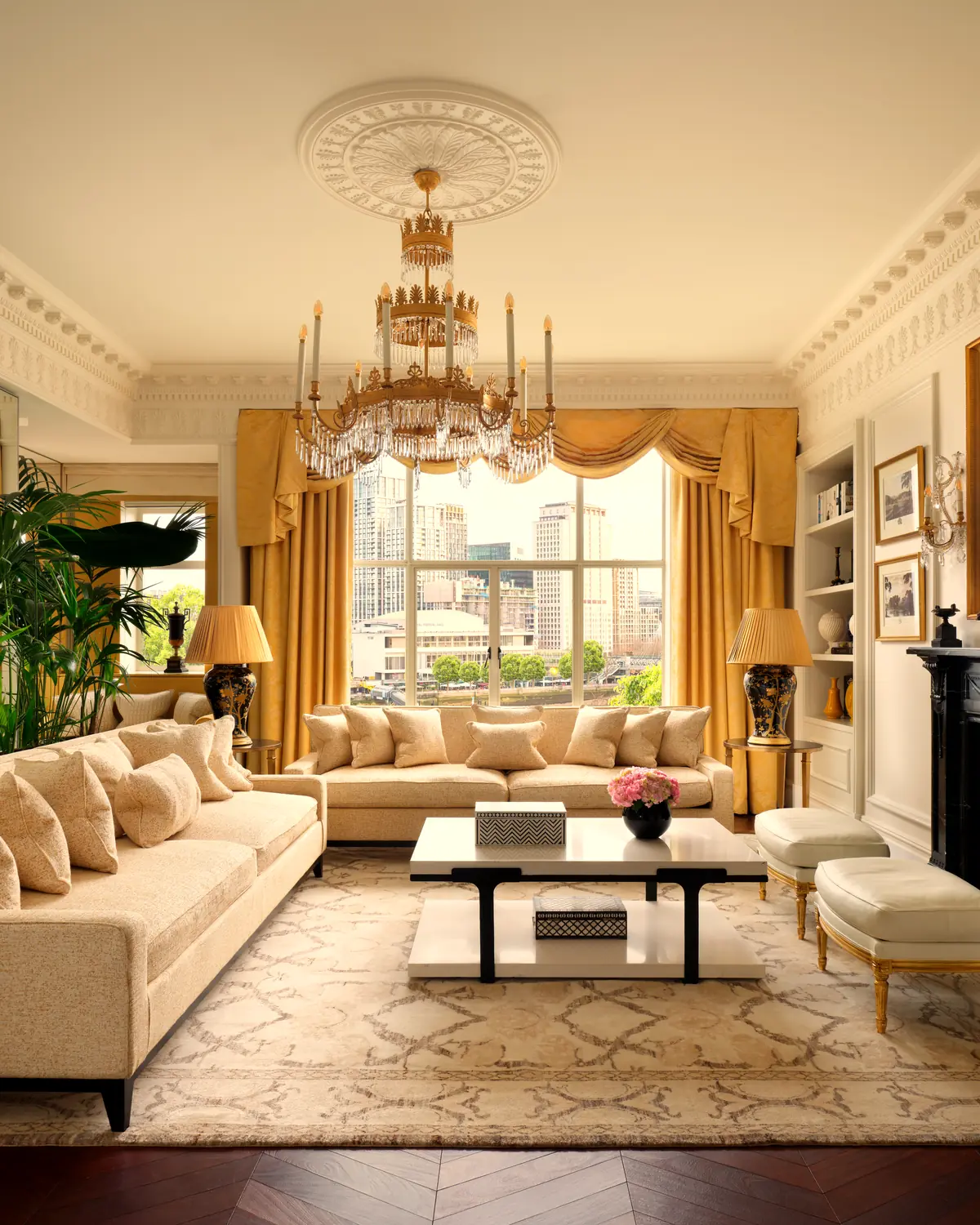 Living room of the Royal Suite: sofas, chandelier, fireplace and tall windows (album 'The Royal Suite')