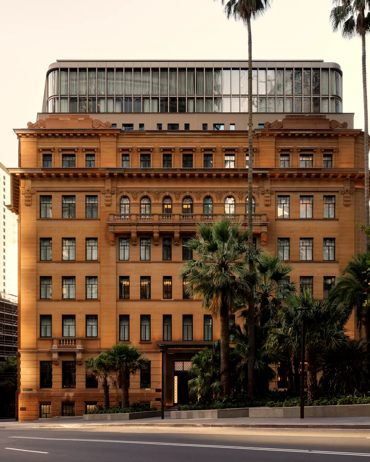 Sandstone facade of the former Department of Education building and main entrance on Farrer Place (gallery file "Capella Sydney Main Entrance - Farrer Place...